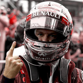 Sebastian Vettel appears in his Red Bull racing days with the visor flipped open holding up one finger to the camera. The blue has been changed to red hue in the photograph.
