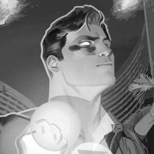 Hal Jordan in a black and white image from a Doc Shaner variant cover holds up his fist as the Green Lantern costume begins to appear over him.